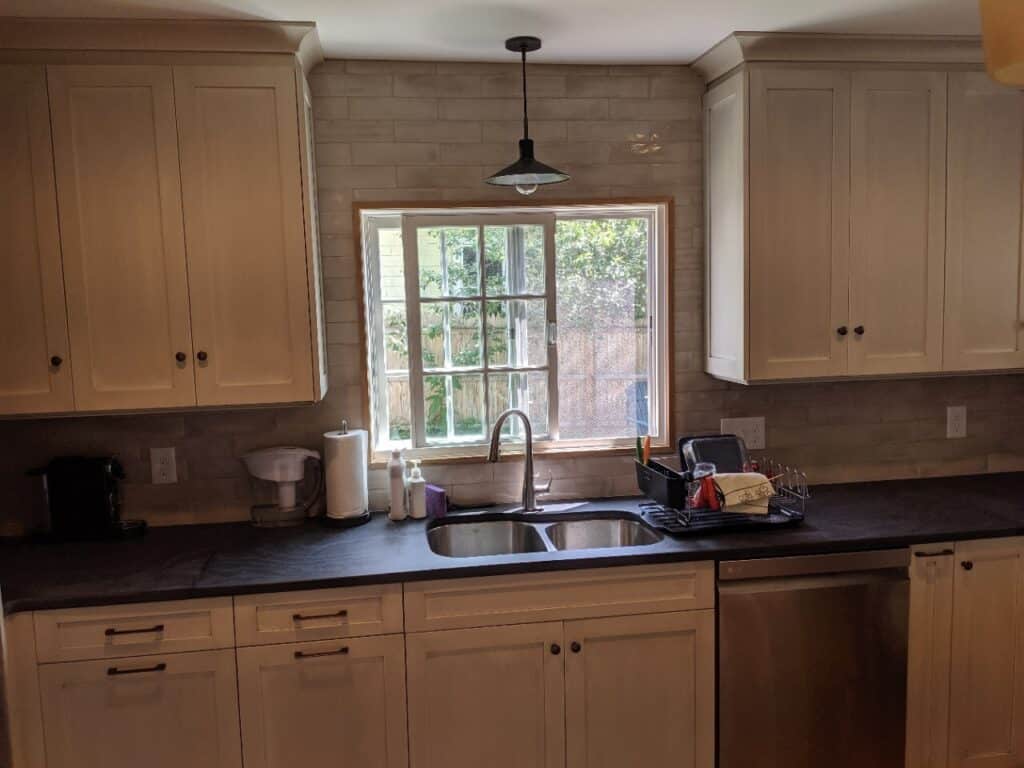 A slider window placed in a kitchen remodel