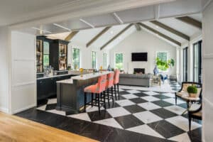 Luxury home addition in East Greenwich, RI with black and white checkered floors, cathedral ceilings, and chic stylings. One of Red House's Top Renovations in Rhode Island