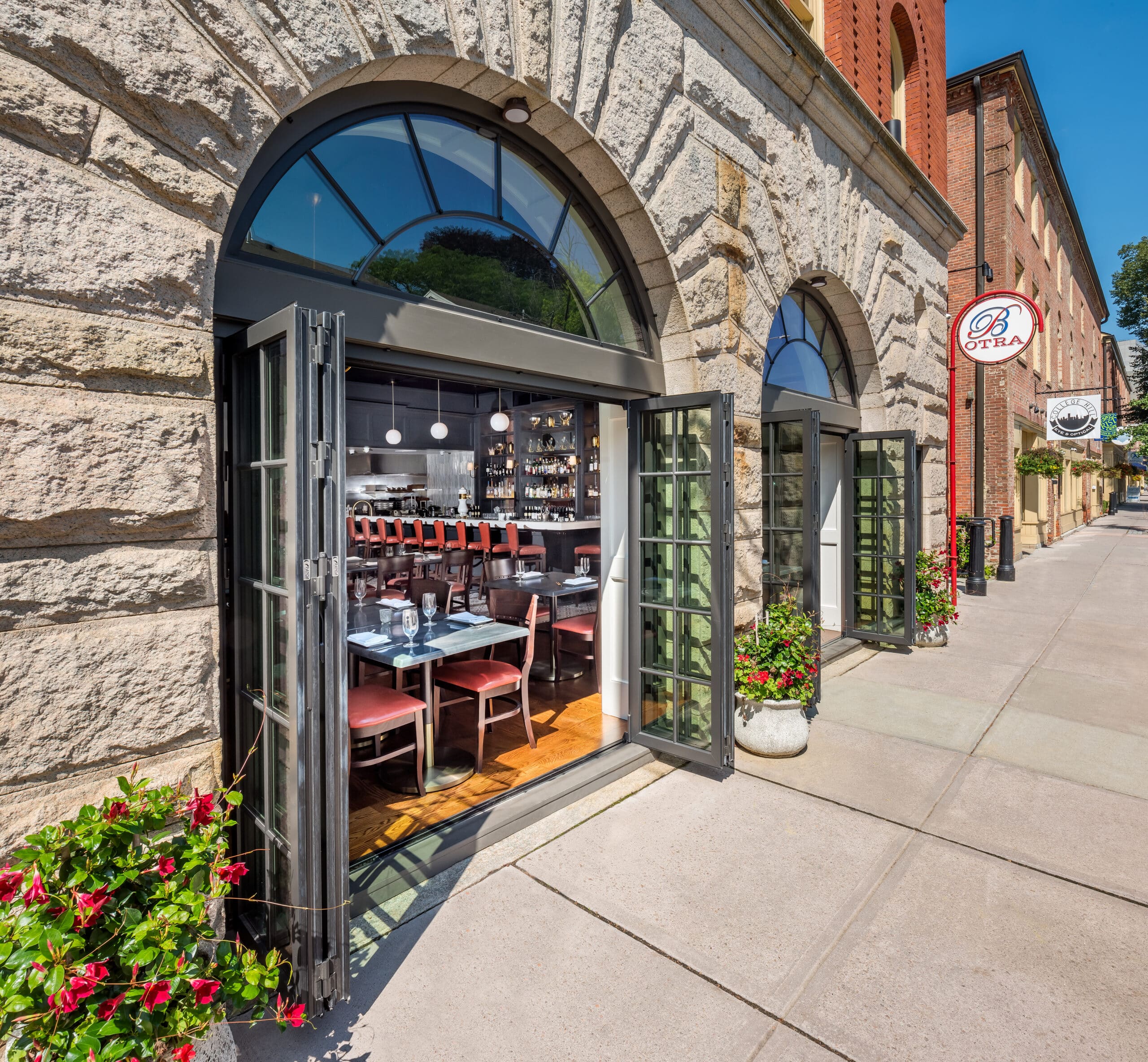 custom bi-fold doors open the restaurant up to the street, enticing passersby.