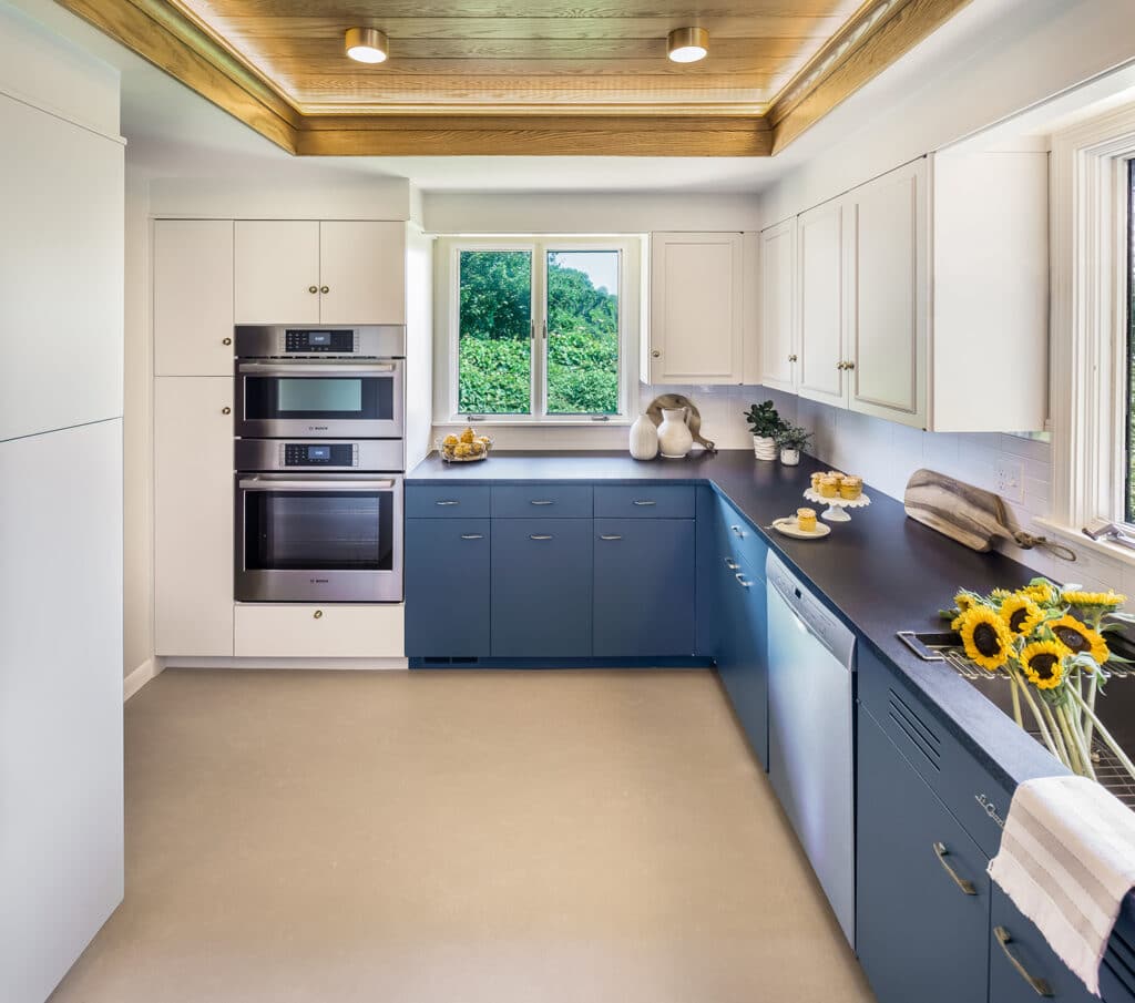 the metal cabinets and marmoleum flooring steal the spotlight in this Charlestown, RI kitchen Design