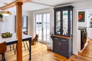 New french doors in this historic home's new kitchen allow more sunlight inside.