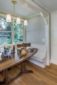 one wall of the custom breakfast nook, the mudroom is on the other side