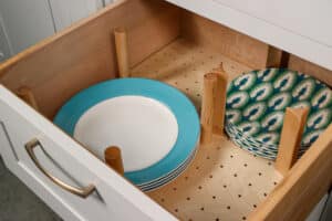Pegboard organizer with plates and other flatware